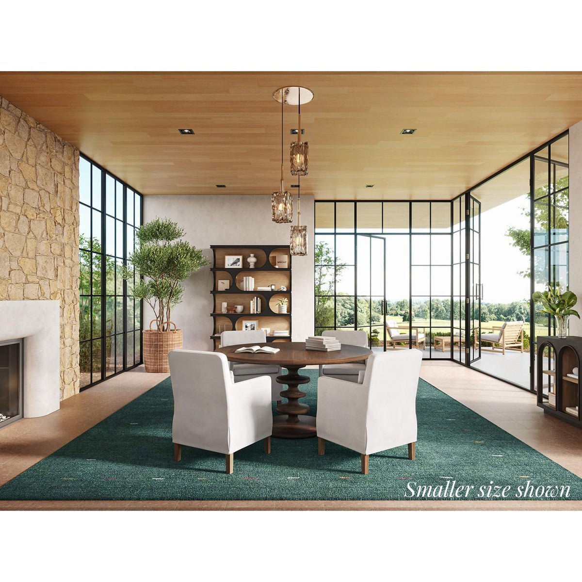 Spacious dining room featuring round table and large windows.