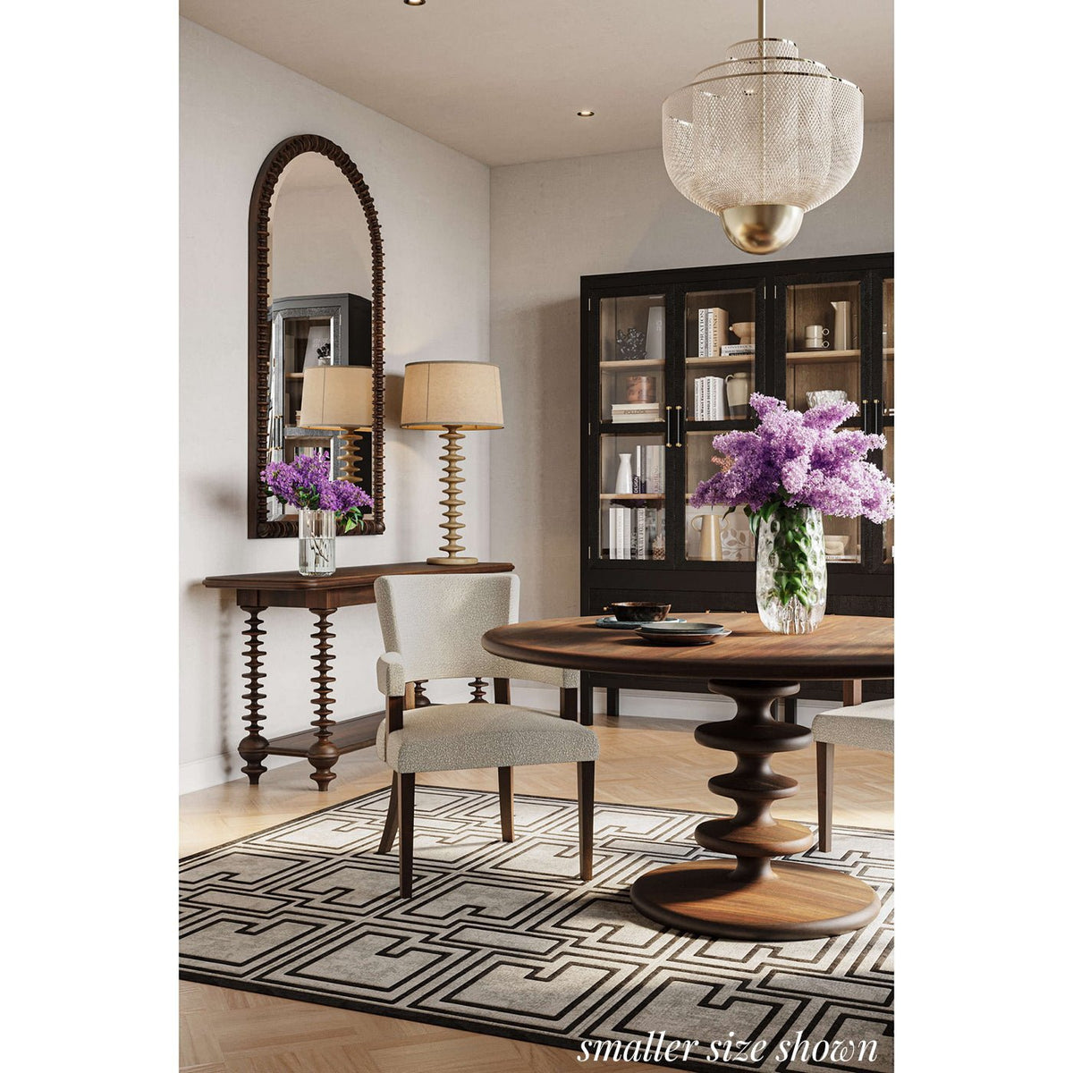 Elegant dining area with round table and rug.