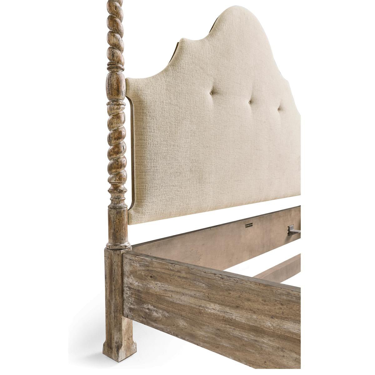 Close-up of upholstered headboard on rustic farmhouse bed.